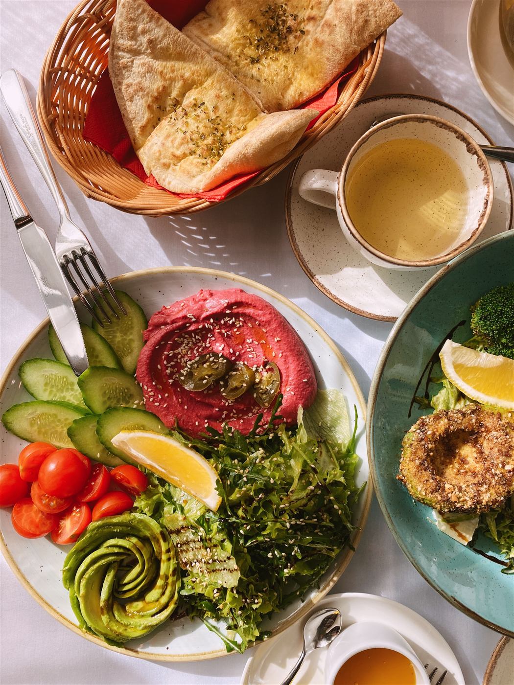 Table spread of mezze, salads and fresh bread from a Cleveland Meal Prep event